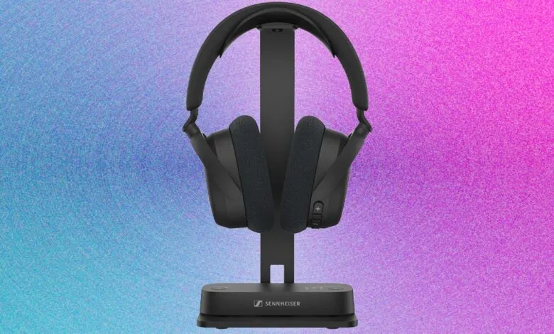 Black Sennheiser RS 175 TV wireless headphones on charging stand.