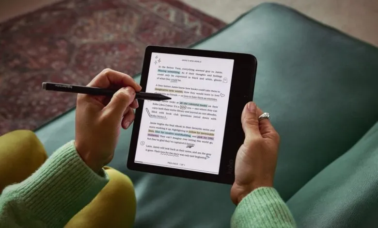 Person using Kobo eReader with stylus to highlight text, close-up view.