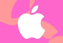 White Apple logo on pink and peach abstract background.