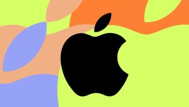 Apple logo in black against a colorful abstract background.