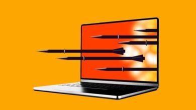 Laptop screen with missiles flying out, symbolizing cyber warfare.