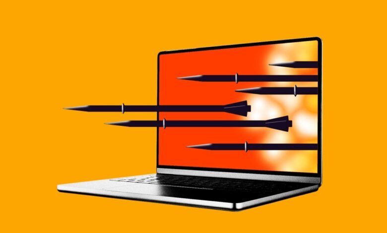 Laptop screen with missiles flying out, symbolizing cyber warfare.