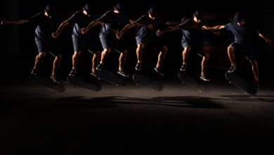 Multiple exposures show skateboarder in mid-air performing a trick.