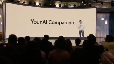 Presenter on stage with 'Your AI Companion' text on large screen, audience visible.