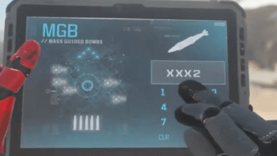 Tablet displays 'MGB Mass Guided Bombs' with targeting interface and bomb selection.