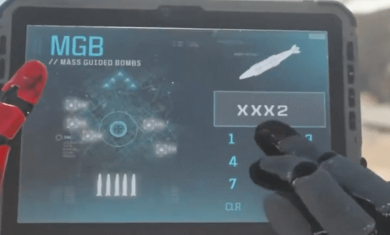 Tablet displays 'MGB Mass Guided Bombs' with targeting interface and bomb selection.