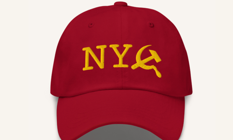 Red baseball cap with yellow 'NYC' and hammer & sickle embroidery.