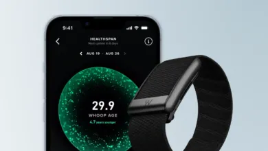 Whoop band and phone displaying Healthspan app showing a Whoop age of 29.9.