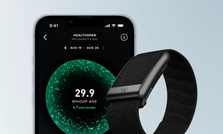 Whoop band and phone displaying Healthspan app showing a Whoop age of 29.9.