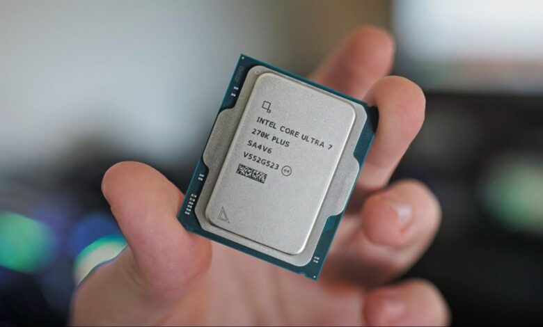 Hand holds Intel Core Ultra 7 270K Plus CPU, close-up view.