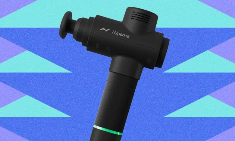 Black Hyperice massage gun against a blue and teal geometric background.
