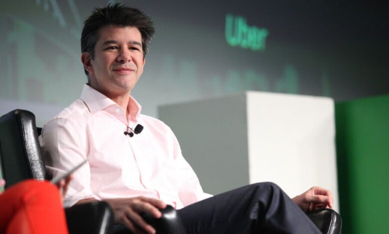 Travis Kalanick, former Uber CEO, sits on stage with a microphone.