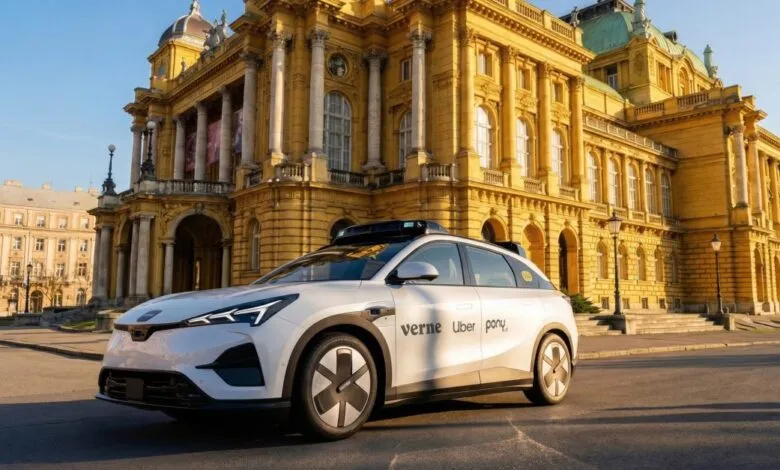 Self-driving Verne Uber Pony car parked near a grand, ornate building.