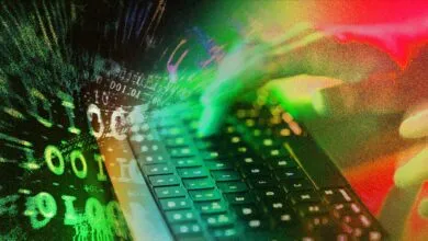 Hands type on keyboard with binary code overlay, suggesting cybersecurity.