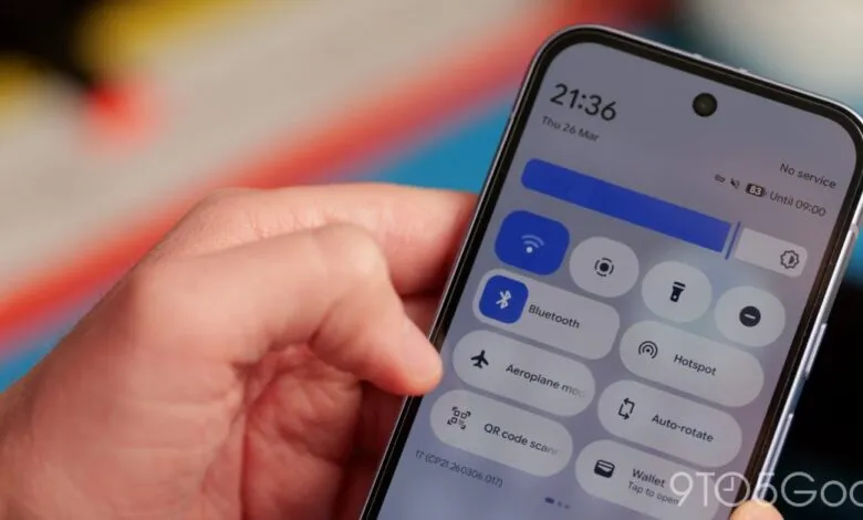 Hand interacting with Android phone's quick settings menu.