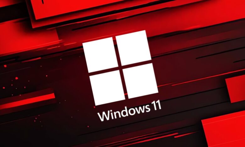 Windows 11 logo on a red and black abstract background.