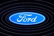 Ford logo in blue and white with concentric circles around it.