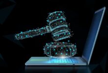 Digital gavel hovers over laptop, representing online legal proceedings.