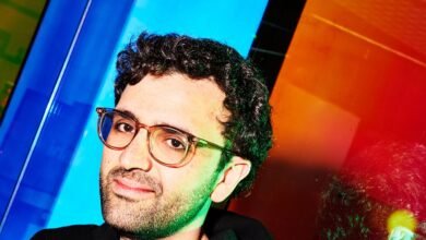 Alon Lombard, CEO of Kalshi, poses with glasses.