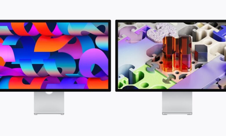 Two Apple Studio Displays showing different vibrant abstract wallpapers.