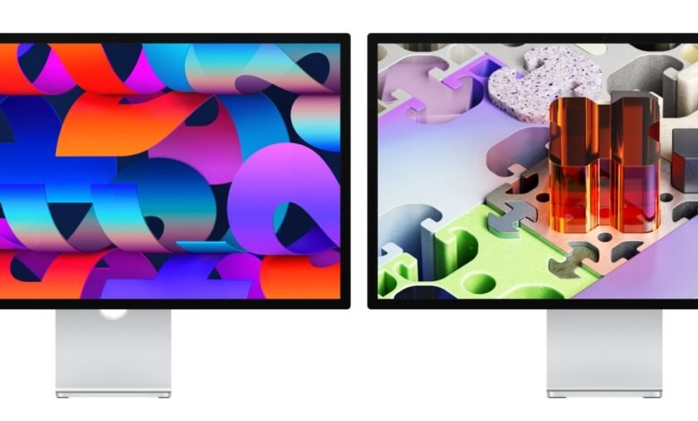 Two Apple Studio Displays showing vibrant abstract wallpapers.