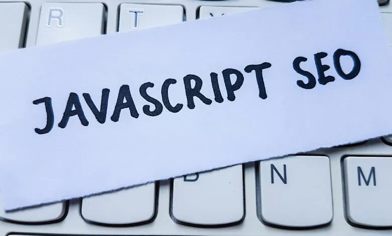 Paper with 'Javascript SEO' on a white keyboard.