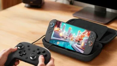 Handheld gaming console in case with controller, screen showing game.
