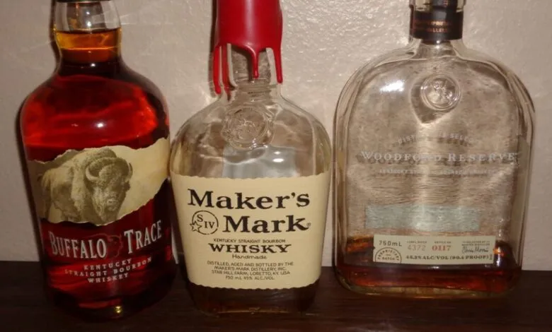 Three bourbon bottles: Buffalo Trace, Maker's Mark, and Woodford Reserve.