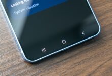 Close-up of smartphone screen showing navigation buttons and system settings.