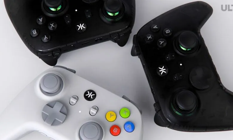 Three CRKD Ult Pro controllers in white and black, showcasing design and features.