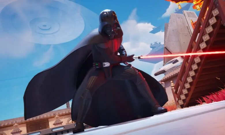 Darth Vader stands with lightsaber in Fortnite game environment.