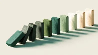 Domino effect with colorful wooden blocks in a row.