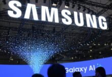 Large Samsung sign with falling confetti at a tech event.