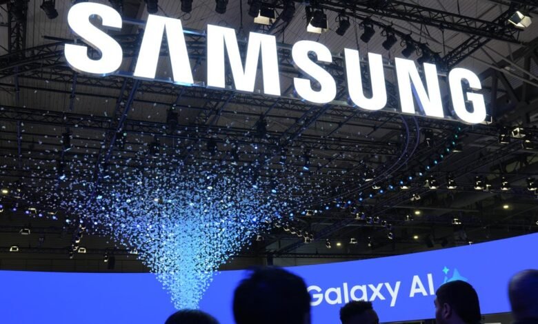Large Samsung sign with falling confetti at a tech event.