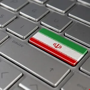 Keyboard key with the Iranian flag on it, next to the pause button.