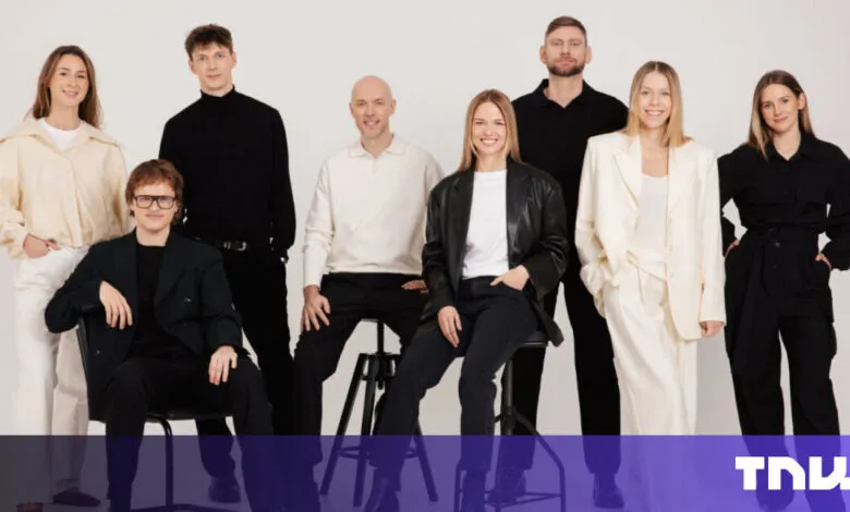 Group of nine diverse professionals in stylish black and white attire.