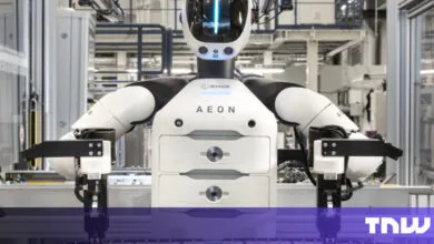 Hexagon AEON robot with white and black design in a factory setting.