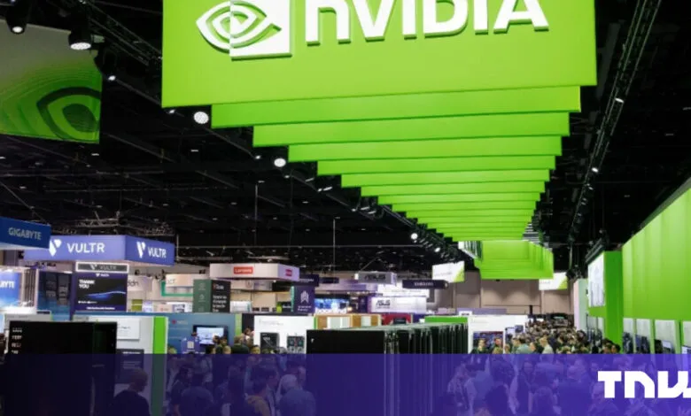 NVIDIA booth at a tech conference, crowded with attendees.