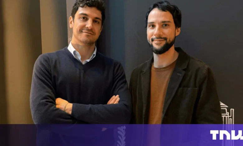 Two men stand side-by-side in a casual portrait.