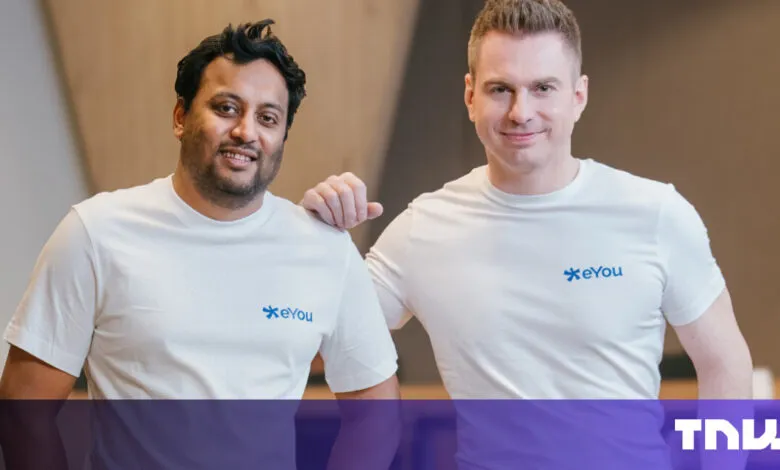 Two men in white shirts with the eYou logo stand smiling.