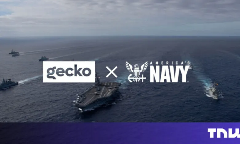 Gecko and US Navy partnership logo over aircraft carrier formation.