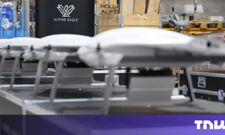Row of Alpine Eagle drones in a warehouse setting, ready for deployment.