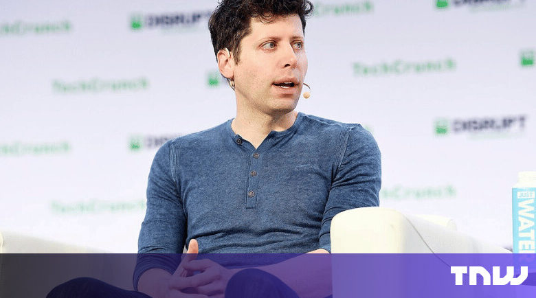 Man in blue shirt speaking at TechCrunch Disrupt conference.