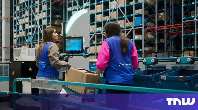 Two Decathlon workers in a warehouse managing inventory.