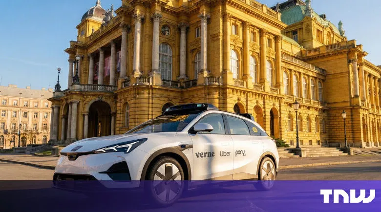 Self-driving Verne Uber Pony car in front of a historic building.