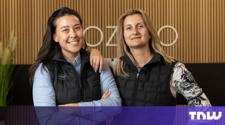 Two smiling women pose in front of the 'Ozoro' logo.