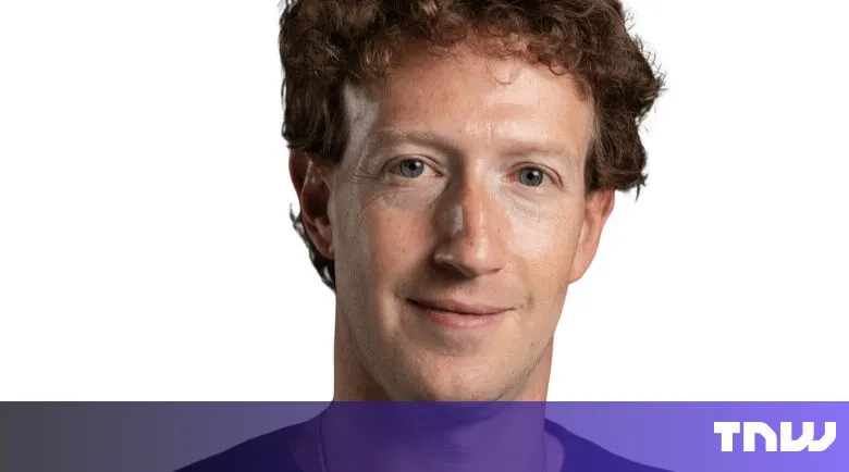 Close-up of Mark Zuckerberg with a slight smile against a white background.