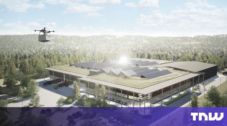 Drone delivers package to modern building with solar panels and green roof.