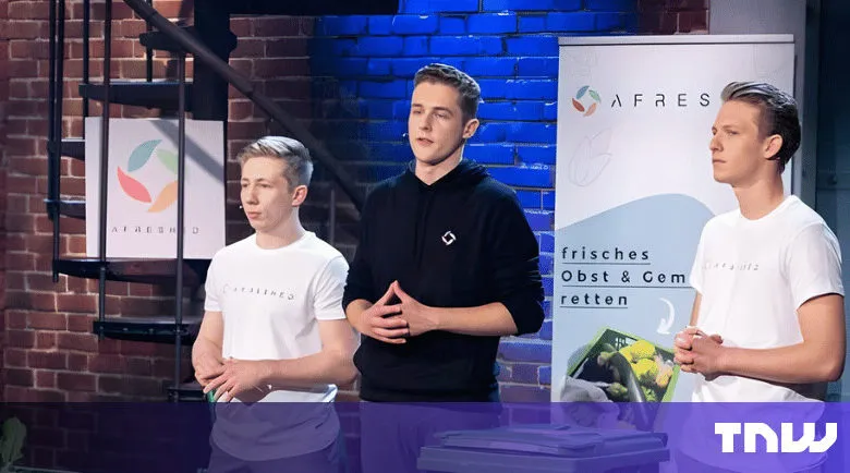 Three young entrepreneurs present their product, Afreshed, on a stage.
