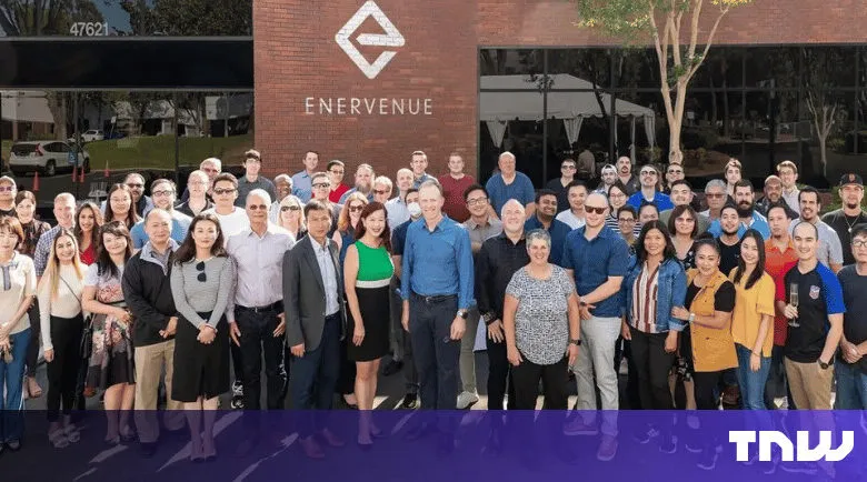 Group of EnerVenue employees posing in front of their company building.